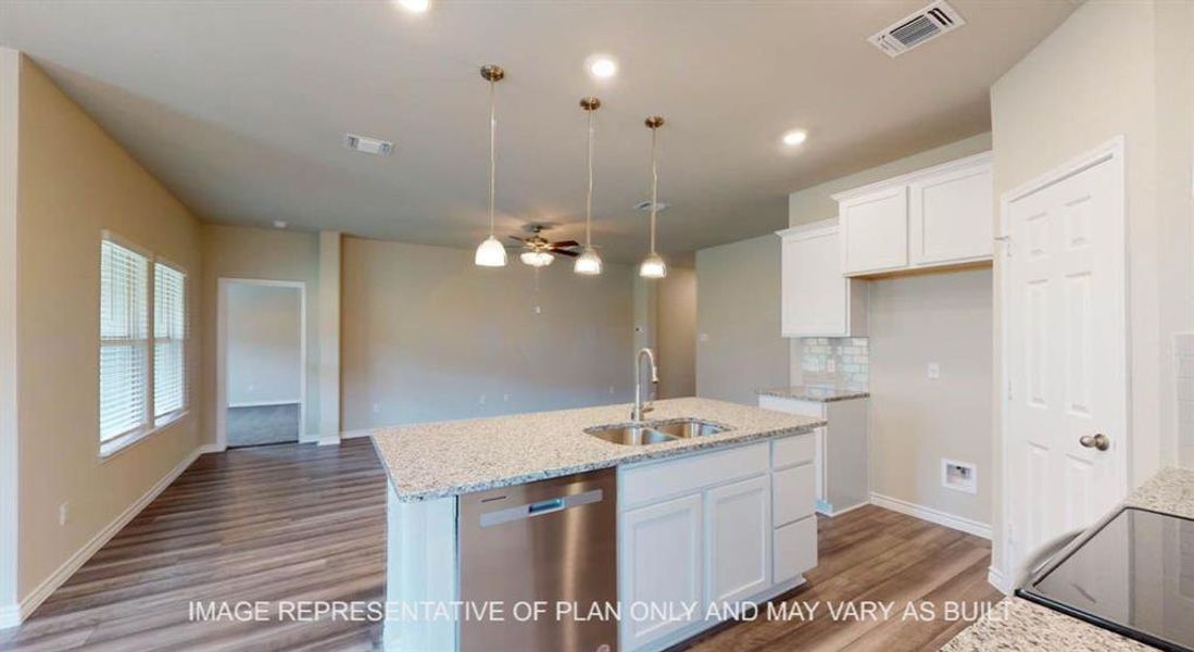 Kitchen with dishwasher, light stone counters, hanging light fixtures, a ceiling fan, and recessed lighting Kitchen with dishwasher, light stone counters, hanging light fixtures, a ceiling fan, and recessed lighting
