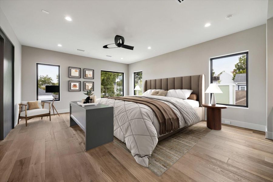 The large primary bedroom offers a spacious retreat designed for comfort and relaxation. An entertainment center is thoughtfully positioned at the foot of the bed, creating a perfect space to unwind and enjoy while maintaining a clean, functional layout.
