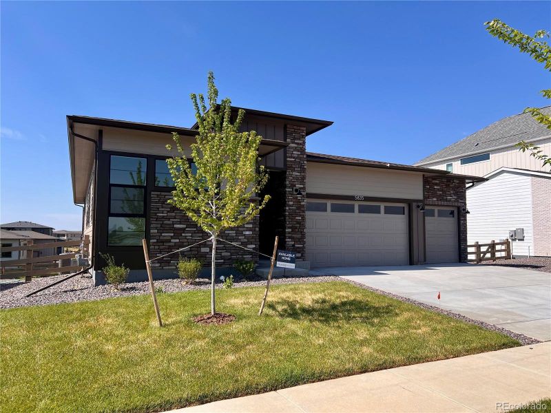 Front exterior of a new home in Kitchel Lake at Serratoga Falls, Timnath, CO, highlighting curb appeal (Image 18).