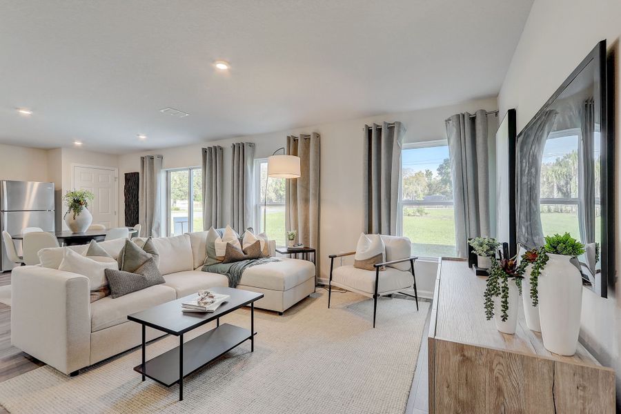 A large living room with a large window.