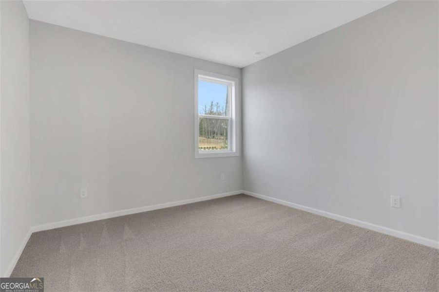 Spacious, unfurnished interior of a new home in The Paddocks at Doc Hughes, Buford (Image 53).