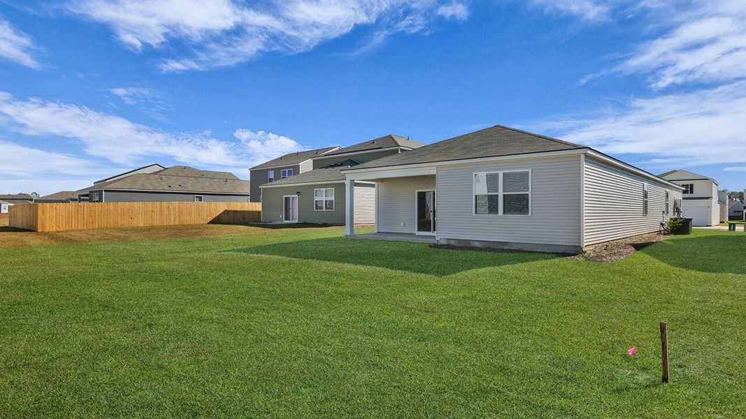 Exterior details and patio area of a home in Pine Hills at Cane Bay, Summerville (Image 23).