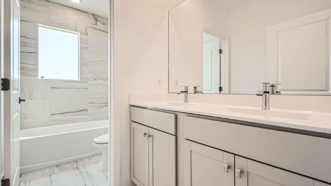 Representative furnished interior of a home built from the Ponte Vedra by D.R. Horton in Preserves at Park Trace, Stuart (Image 11).
