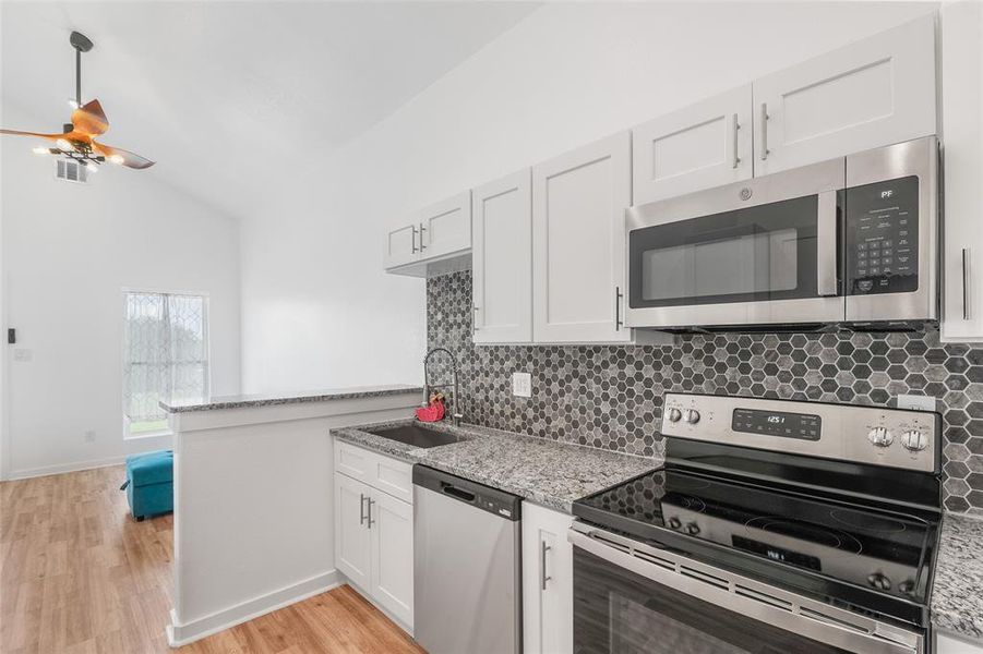 This is another view  of the kitchen  looking out into the living room.