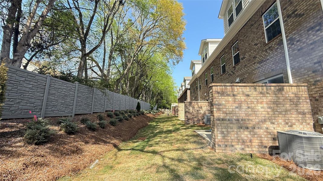 Exterior details and patio area of a home in The Townes at Wade Ardrey, Charlotte (Image 3).