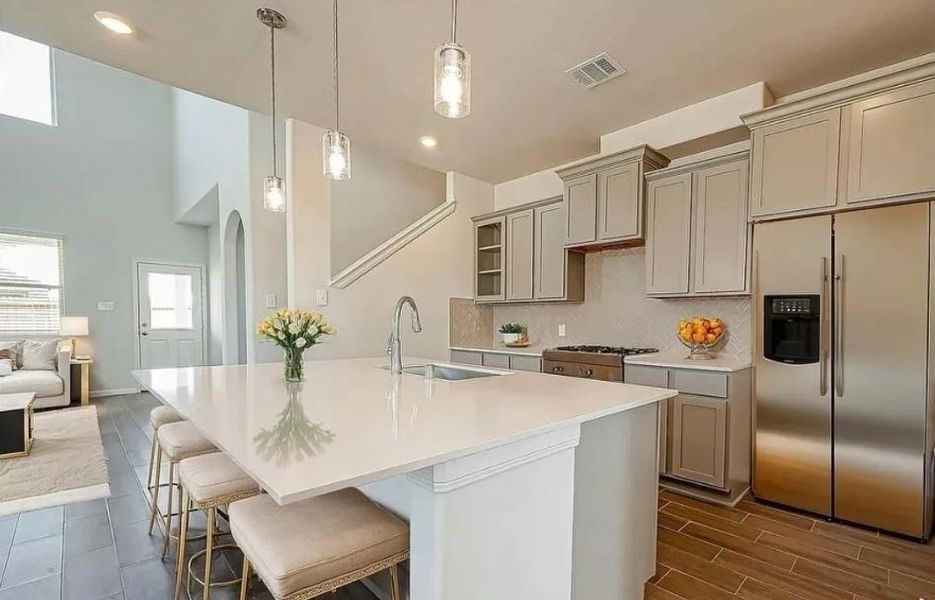 Open, bright, and beautifully designed-the perfect kitchen and gathering space for everyday living and entertaining. ?Representative photo
