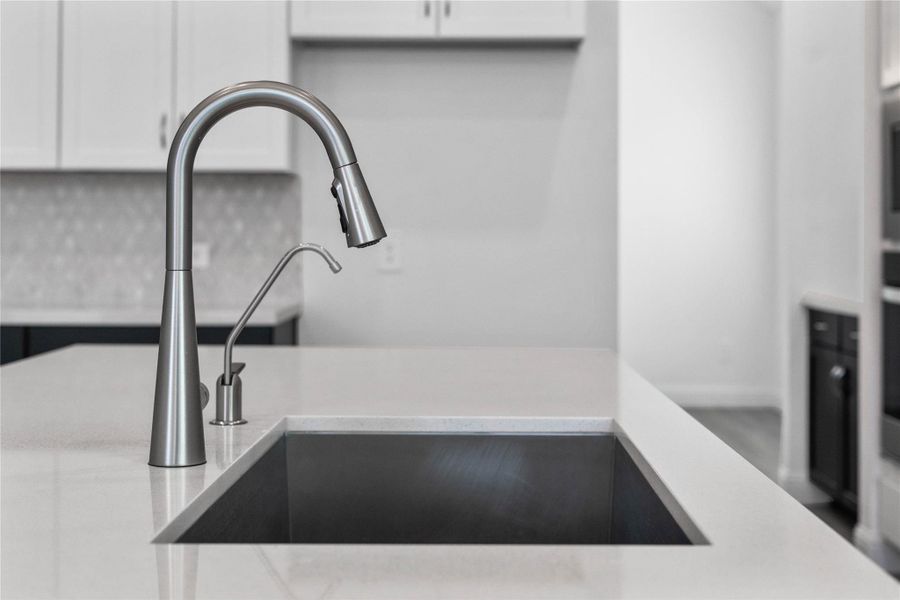 Moen Sleek Stainless Steel faucet offers versatility and contemporary design, complemented by a convenient separate filtered water dispenser faucet. Moen Sleek Stainless Steel faucet offers versatility and contemporary design, complemented by a convenient separate filtered water dispenser faucet.