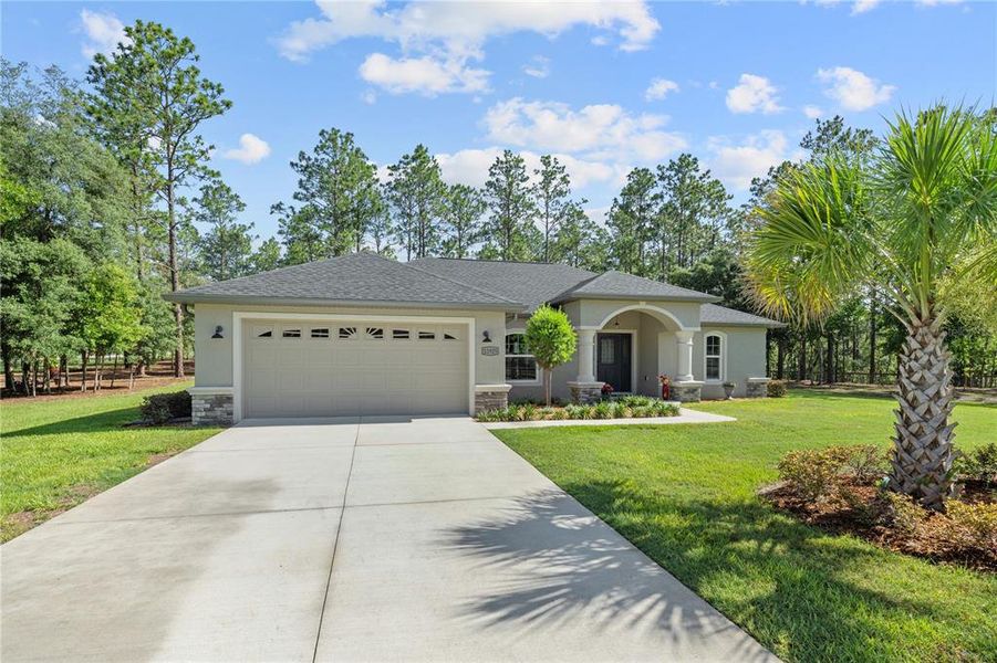 Front exterior of a new home in , Dunnellon, FL, highlighting curb appeal (Image 23).
