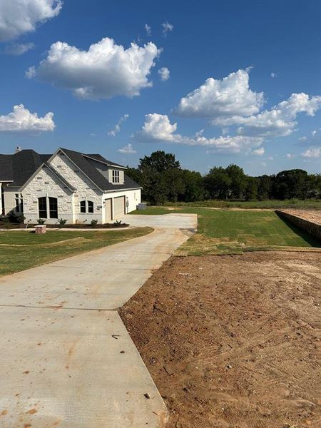 Front exterior of a new home in , Weatherford, TX, highlighting curb appeal (Image 2).