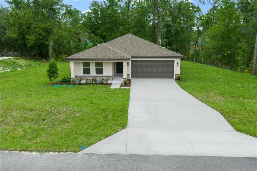 Front exterior of a new home in , Weeki Wachee, FL, highlighting curb appeal (Image 22).