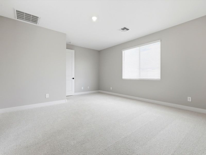 Spacious, unfurnished interior of a new home in White Tank Foothills Signature Series, Waddell (Image 13).