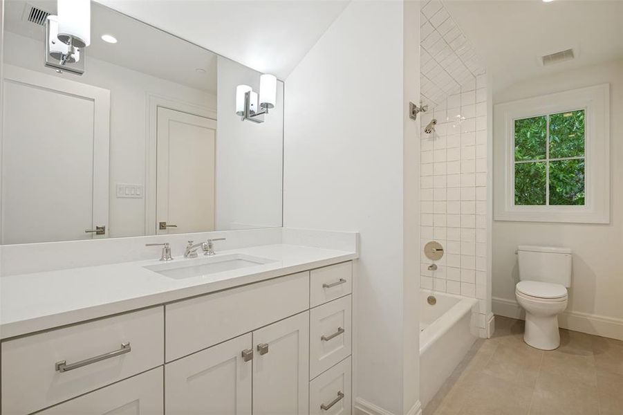 Third-floor Jack and Jill bathroom serving the two adjacent bedrooms. Third-floor Jack and Jill bathroom serving the two adjacent bedrooms.