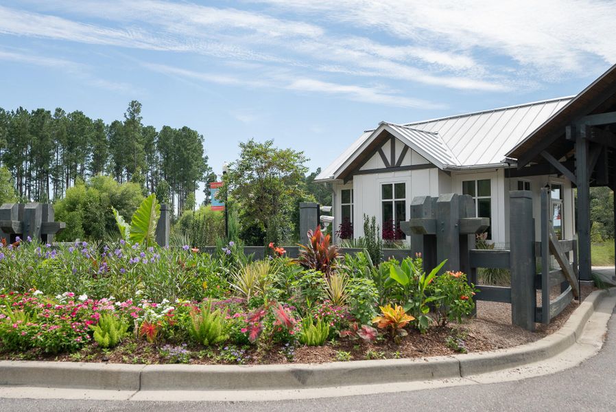 Front exterior of a new home in Horizons at Summers Corner | 55+: The Estates, Summerville, SC, highlighting curb appeal (Image 25).