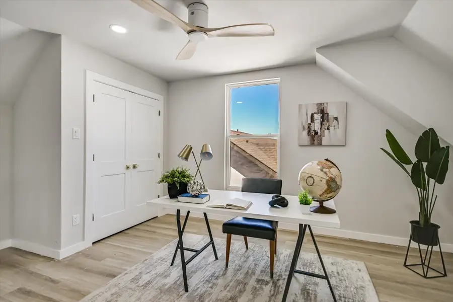Office featuring light wood-type flooring, recessed lighting, ceiling fan, and vaulted ceiling