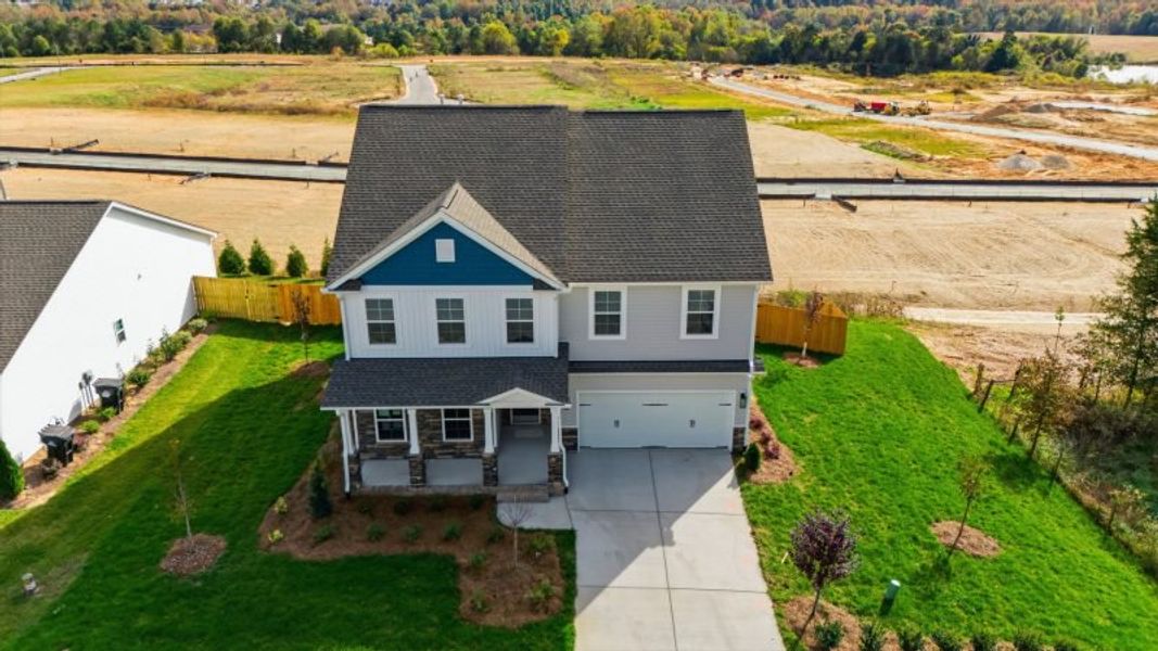 Front exterior of a new home in Miller's Reserve, Winston-Salem, NC, highlighting curb appeal (Image 28). Front exterior of a new home in Miller's Reserve, Winston-Salem, NC, highlighting curb appeal (Image 28).