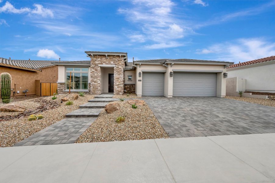 Front exterior of a new home in Canyon Views – 70’ Sunrise Series, Litchfield Park, AZ, highlighting curb appeal (Image 1). Front exterior of a new home in Canyon Views – 70’ Sunrise Series, Litchfield Park, AZ, highlighting curb appeal (Image 1).