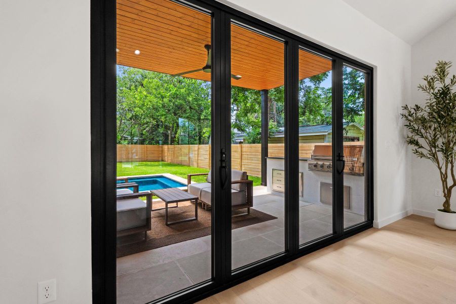Seamless indoor-outdoor living awaits with these expansive sliding glass doors opening to a private backyard oasis. Seamless indoor-outdoor living awaits with these expansive sliding glass doors opening to a private backyard oasis.