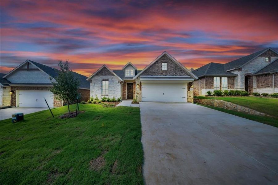Front exterior of a new home in Liberty Pointe, Gainesville, TX, highlighting curb appeal (Image 19).