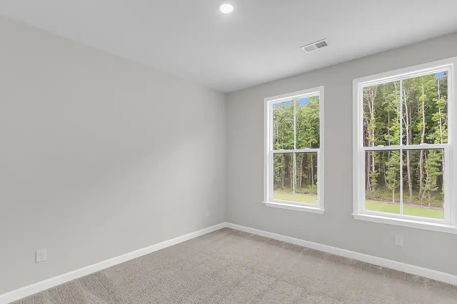 Spacious, unfurnished interior of a new home in Pineland Preserve, Summerville (Image 34).