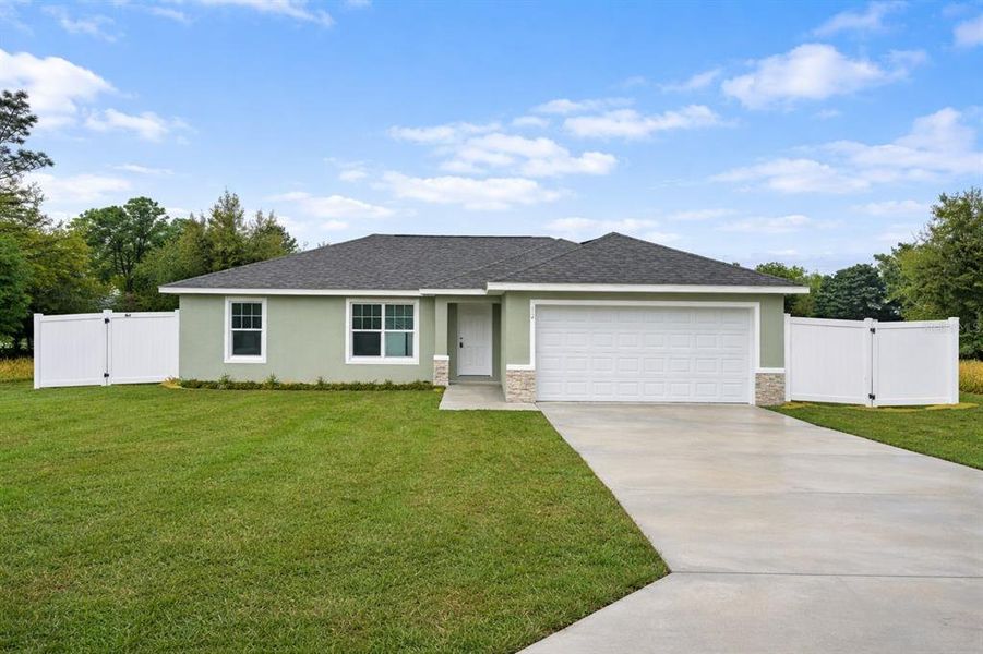 Front exterior of a new home in , Ocala, FL, highlighting curb appeal (Image 1). Front exterior of a new home in , Ocala, FL, highlighting curb appeal (Image 1).