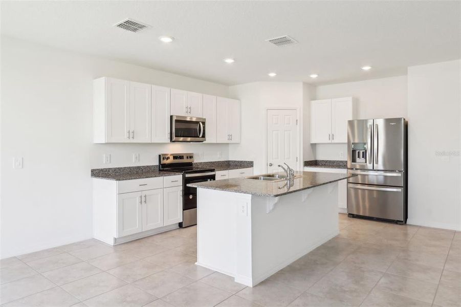 Furnished interior view inside a new home in Lawson Dunes - Signature Series, Haines City (Image 4). Furnished interior view inside a new home in Lawson Dunes - Signature Series, Haines City (Image 4).