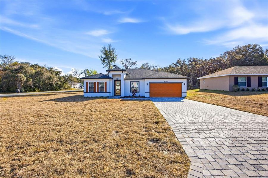 Front exterior of a new home in , Ocala, FL, highlighting curb appeal (Image 2). Front exterior of a new home in , Ocala, FL, highlighting curb appeal (Image 2).