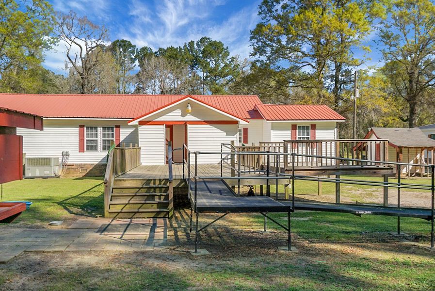 Exterior details and patio area of a home in , Bonneau (Image 28).