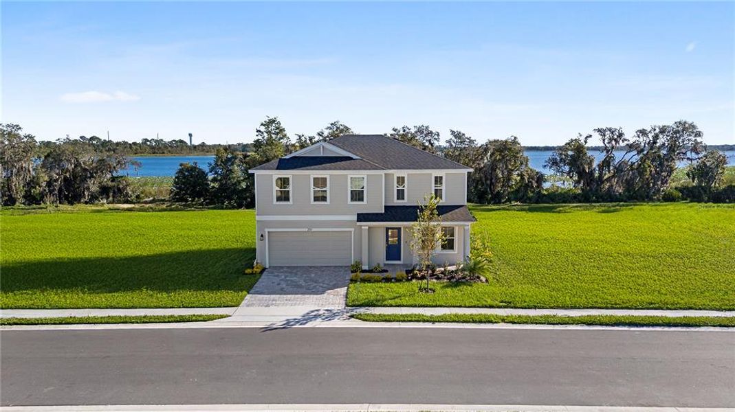 Front exterior of a new home in Willowbrook North, Winter Haven, FL, highlighting curb appeal (Image 24).
