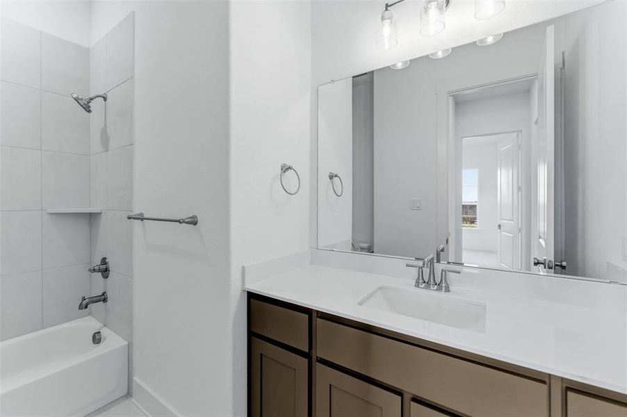 Bathroom with vanity and shower / bath combination