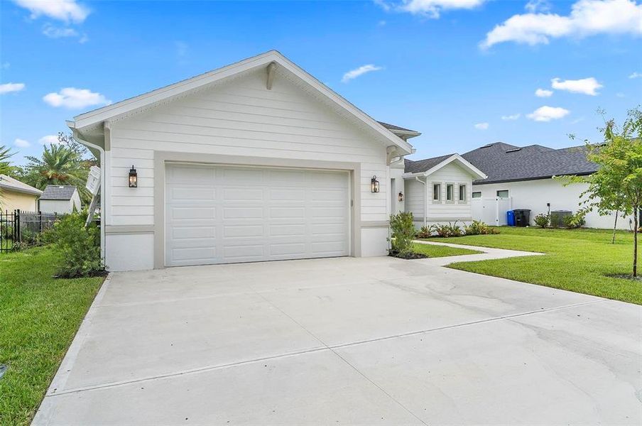 Front exterior of a new home in , Palm Coast, FL, highlighting curb appeal (Image 29).