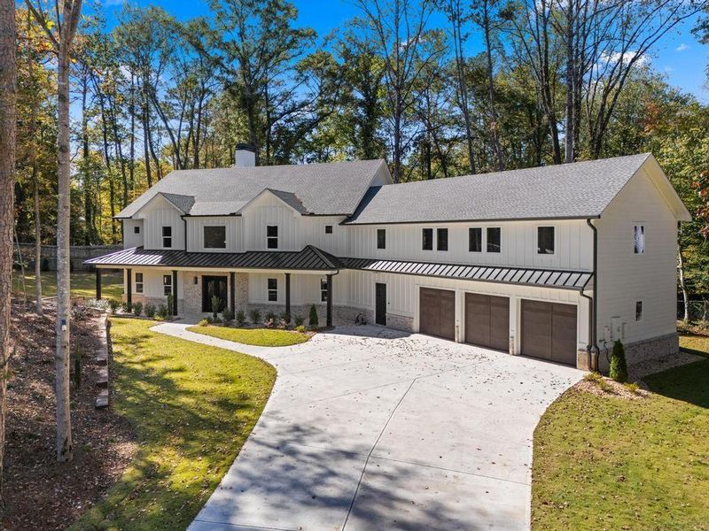 Front exterior of a new home in , Peachtree Corners, GA, highlighting curb appeal (Image 2). Front exterior of a new home in , Peachtree Corners, GA, highlighting curb appeal (Image 2).