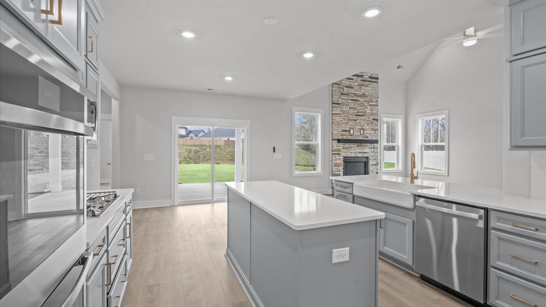 Exceptional culinary space with a striking 9-foot island and eye-catching pendant lights