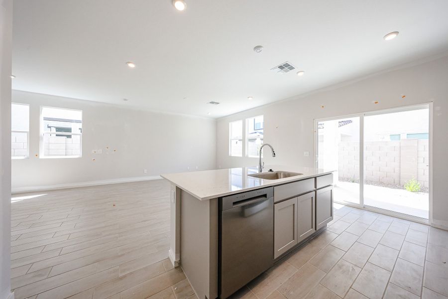 A kitchen with a large glass door. A kitchen with a large glass door.