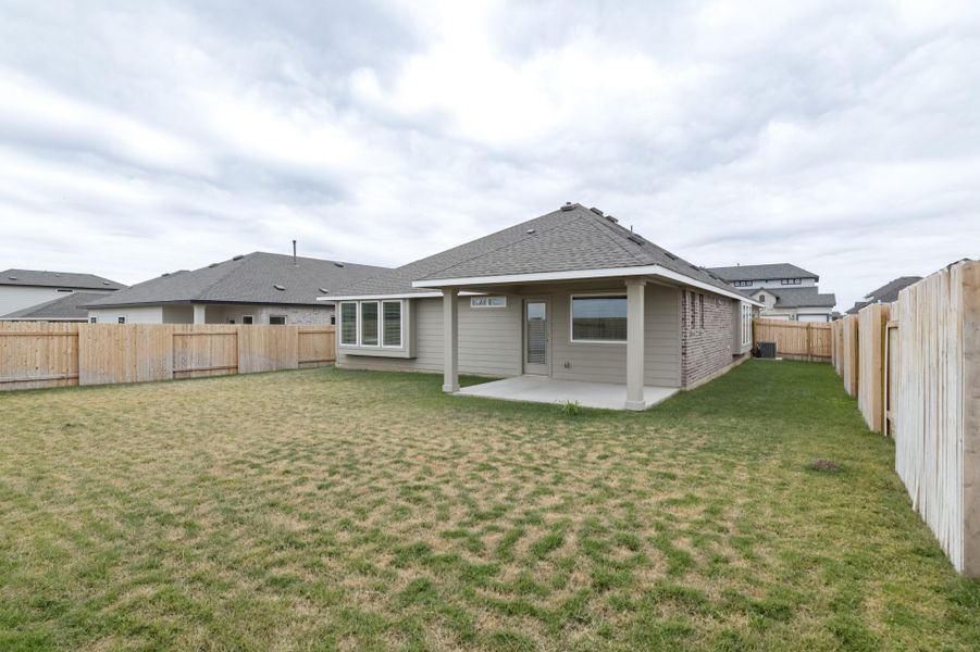 Exterior details and patio area of a home in Village at Three Oaks, Seguin (Image 21).