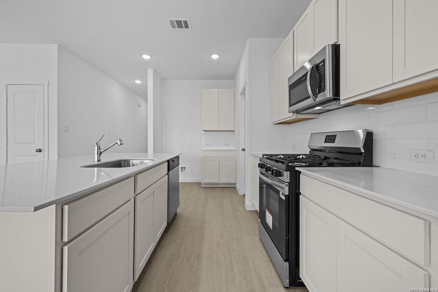 Furnished interior view inside a new home in Voss Farms, New Braunfels (Image 7).