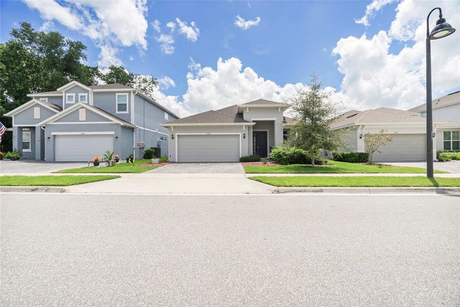 Front exterior of a new home in Summerbrooke, Mount Dora, FL, highlighting curb appeal (Image 26). Front exterior of a new home in Summerbrooke, Mount Dora, FL, highlighting curb appeal (Image 26).