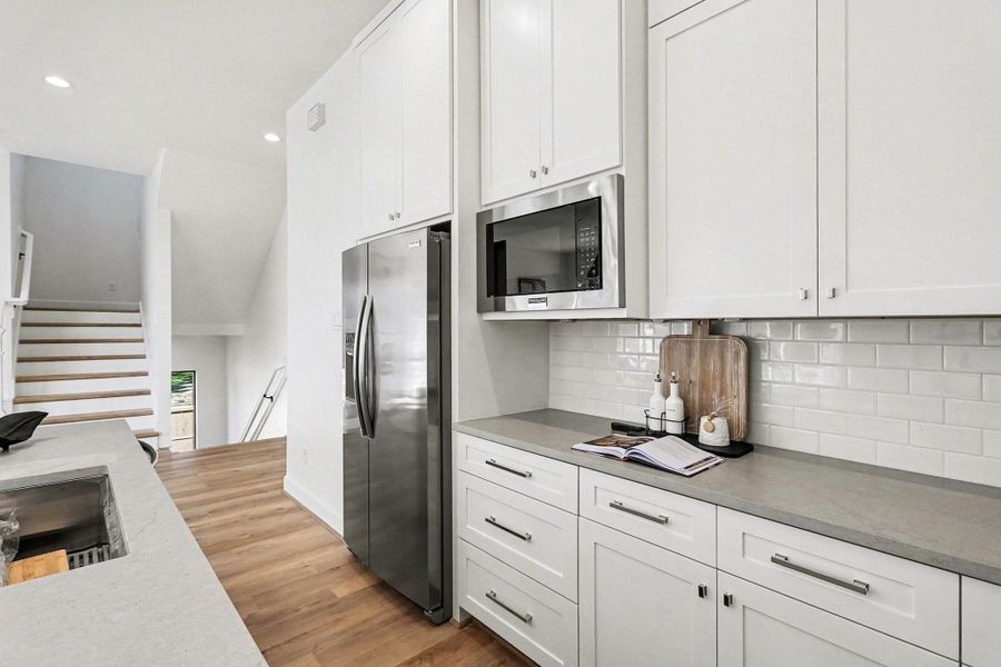 Quartz countertops resemble concrete but are easy care.