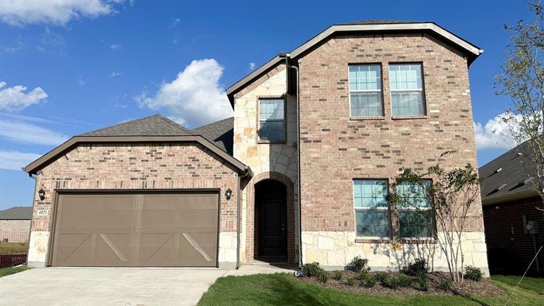 View of front of home with a garage, concrete driveway, brick siding, and a shingled roof View of front of home with a garage, concrete driveway, brick siding, and a shingled roof