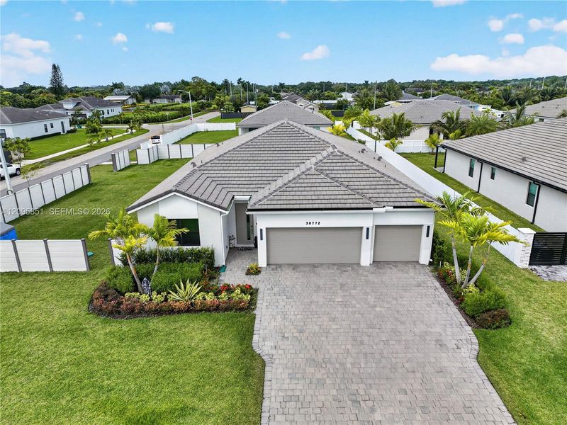 Front exterior of a new home in , Homestead, FL, highlighting curb appeal (Image 21).