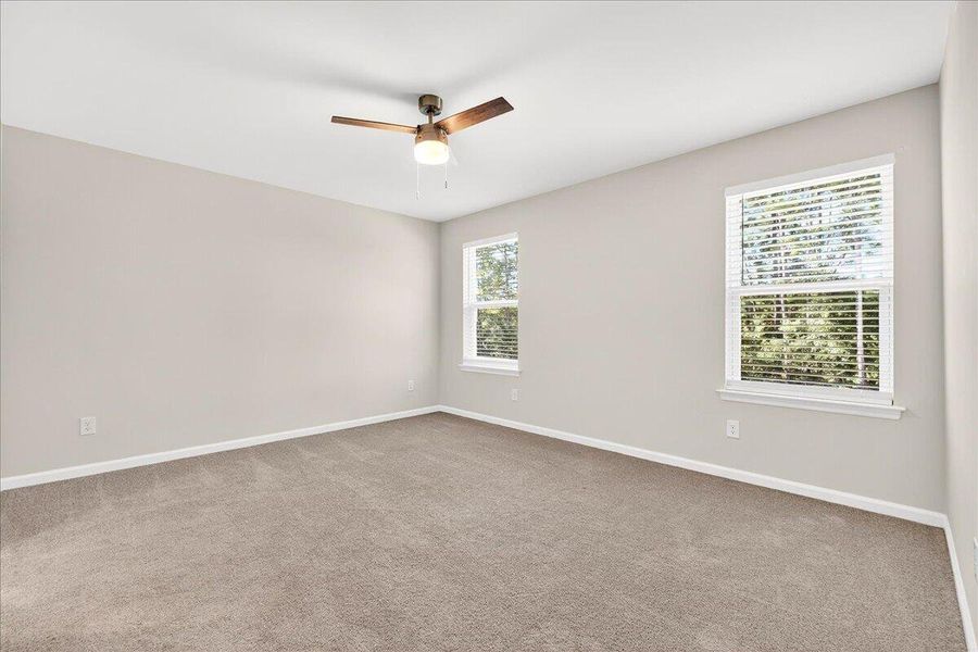 Spacious, unfurnished interior of a new home in Jasmine Point at Lakes of Cane Bay, Summerville (Image 15).