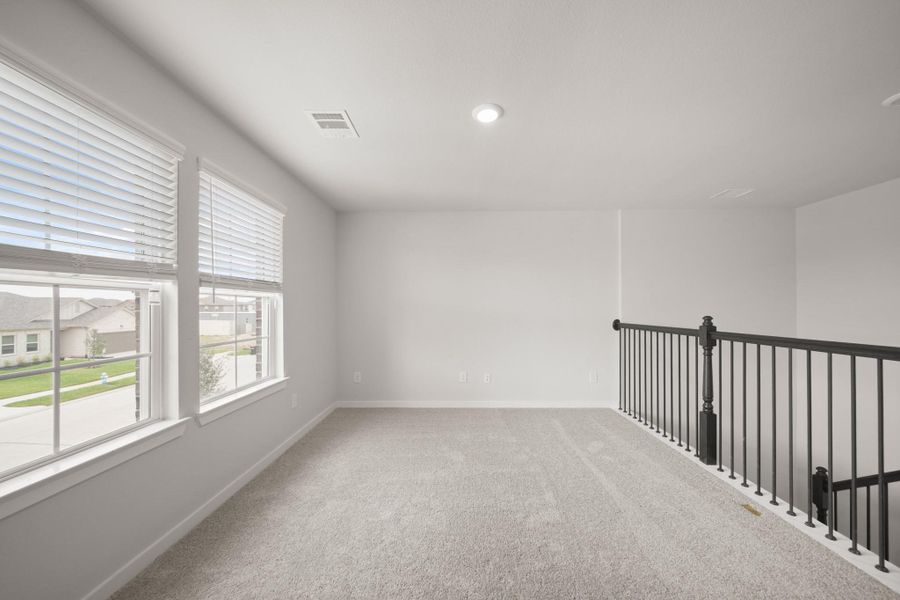 Spacious, unfurnished interior of a new home in Sunterra, Katy (Image 24).