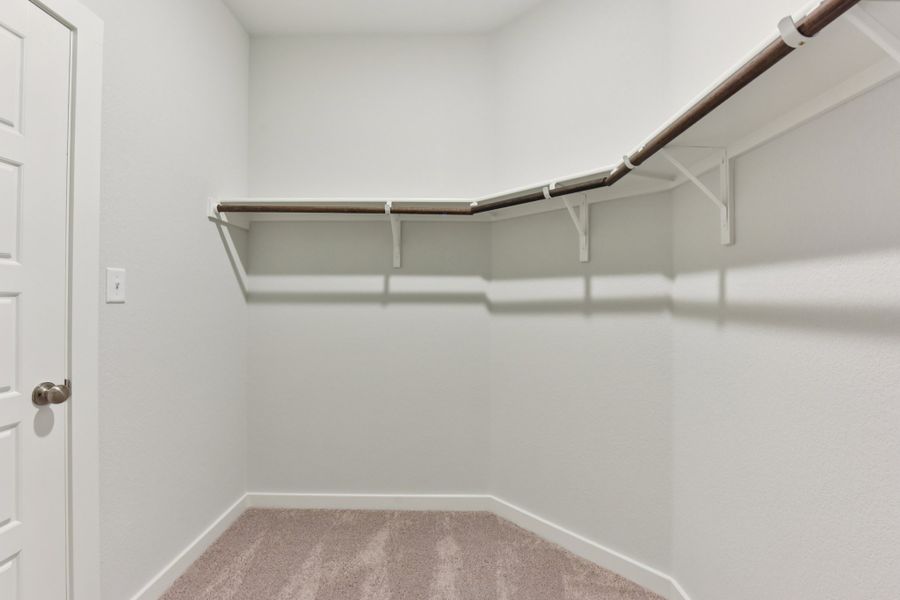A white wall with a metal railing. A white wall with a metal railing.
