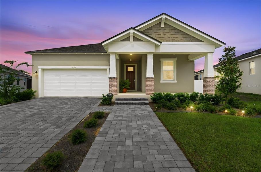 Front exterior of a new home in , Clermont, FL, highlighting curb appeal (Image 27).