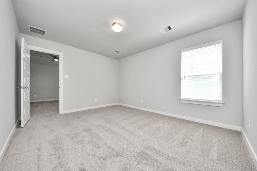 Generously sized secondary bedrooms featuring spacious closets, soft and inviting carpeting underfoot, large windows allowing plenty of natural light, and the added touch of privacy blinds for your personal retreat. Sample photo of completed home with similar floor plan. Actual colors and selections may vary. Generously sized secondary bedrooms featuring spacious closets, soft and inviting carpeting underfoot, large windows allowing plenty of natural light, and the added touch of privacy blinds for your personal retreat. Sample photo of completed home with similar floor plan. Actual colors and selections may vary.