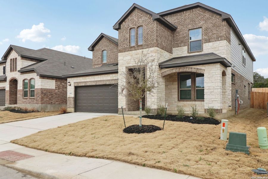 Front exterior of a new home in Fox Falls, Boerne, TX, highlighting curb appeal (Image 28). Front exterior of a new home in Fox Falls, Boerne, TX, highlighting curb appeal (Image 28).
