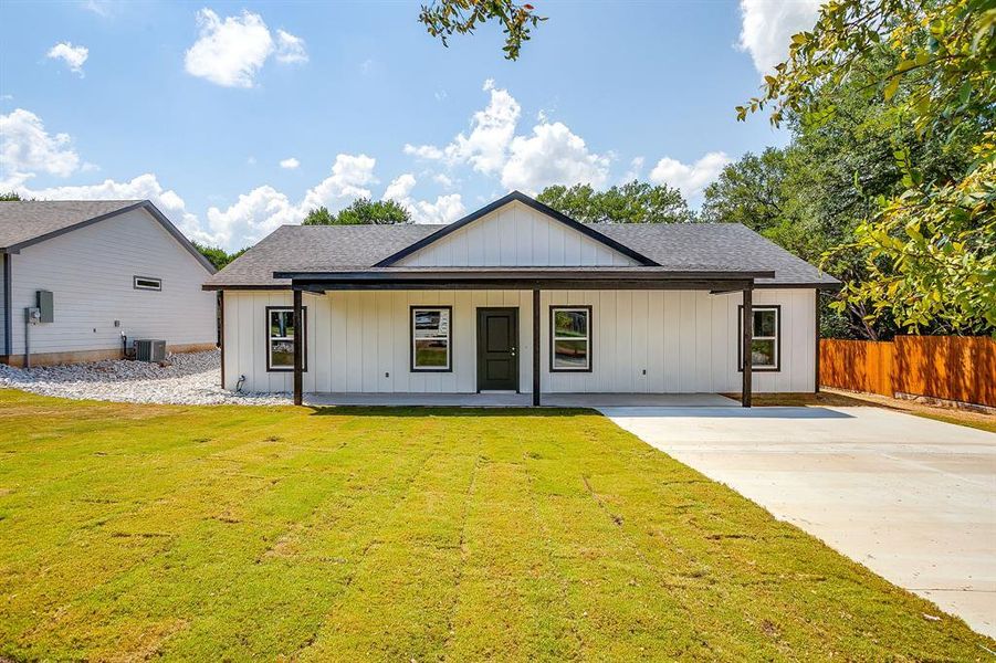 Front exterior of a new home in , Rio Vista, TX, highlighting curb appeal (Image 22). Front exterior of a new home in , Rio Vista, TX, highlighting curb appeal (Image 22).