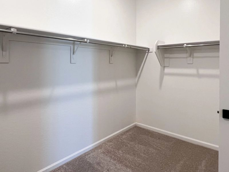 Primary walk in closet Primary walk in closet