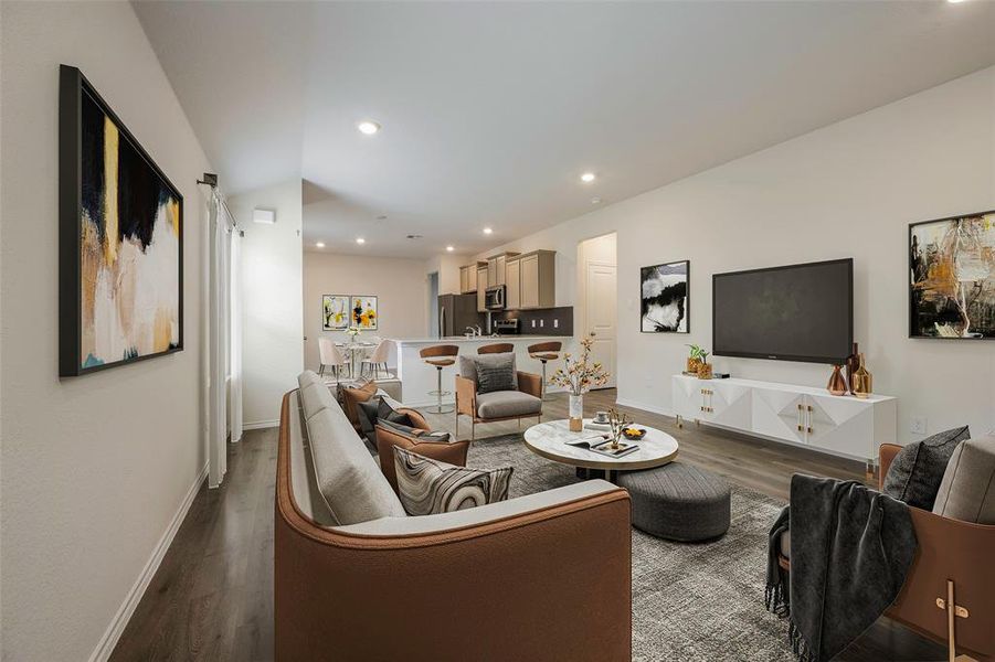 Living room with dark wood-style floors and recessed lighting
