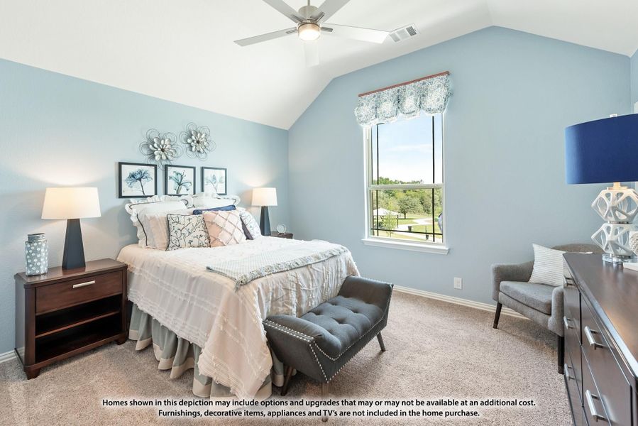 Bedroom with vaulted ceiling, ceiling fan, light blue walls, and carpet flooring with a large window. Bedroom with vaulted ceiling, ceiling fan, light blue walls, and carpet flooring with a large window.