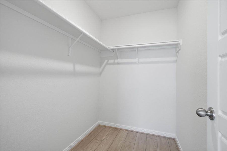 Look at this immaculate closet! With high shelving, multiple rows to hang clothing, you are sure to have enough room for all your belongings!